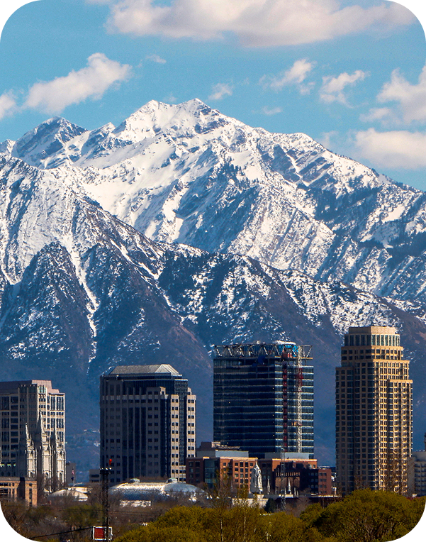 view of a mountain near big buildings of a salt lake city
