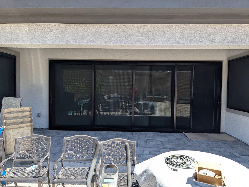 outside patio of a house with security screens sliding door installed by guardian security screens