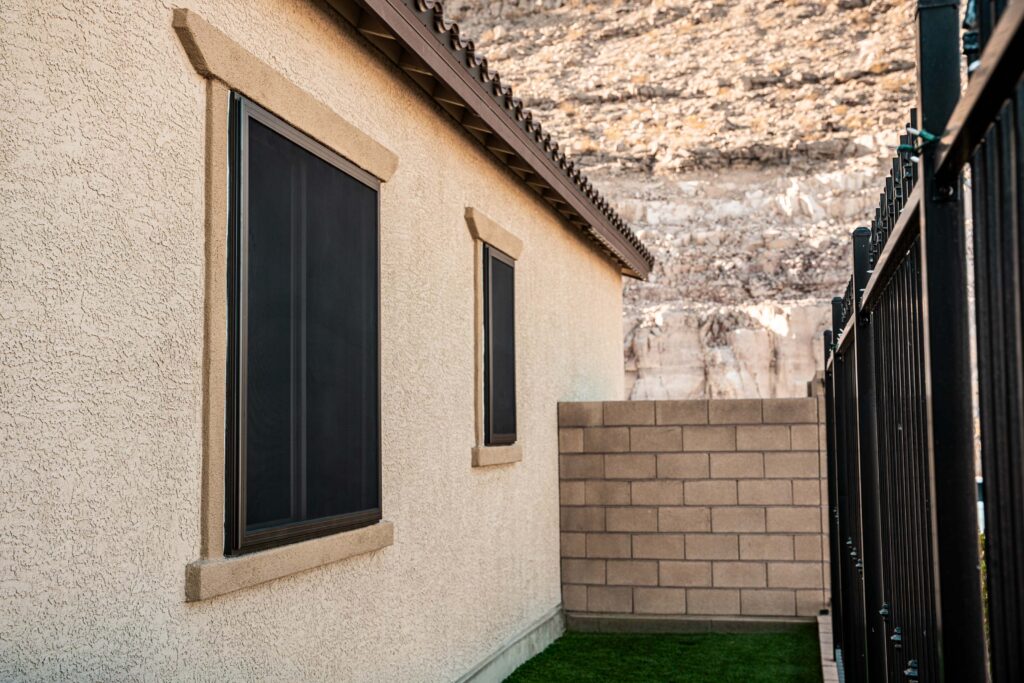 Security screen windows on a residential property, emphasizing safety features for Airbnb and short-term rental hosts.